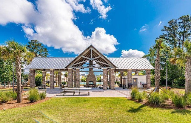 view of home's community with a gazebo and a yard