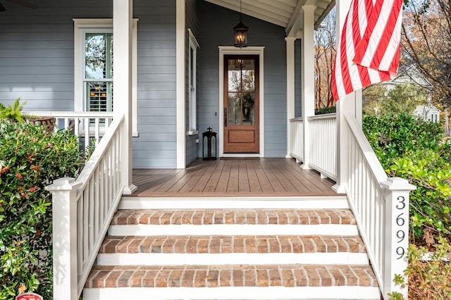 view of exterior entry with covered porch