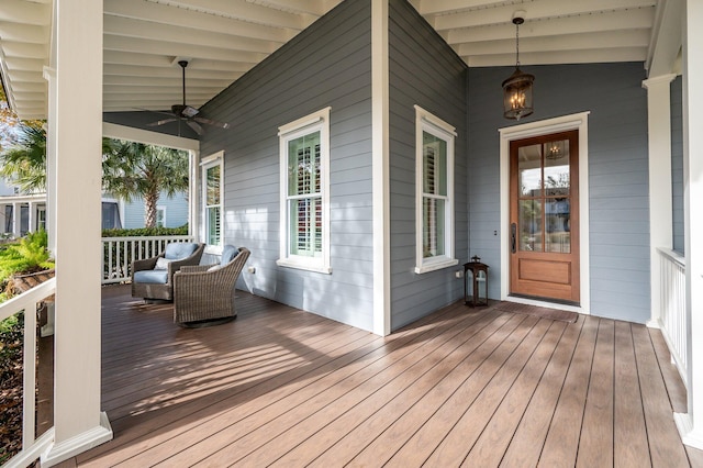 deck with ceiling fan and a porch