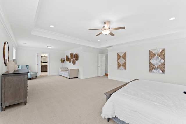 bedroom with light carpet, a raised ceiling, and baseboards