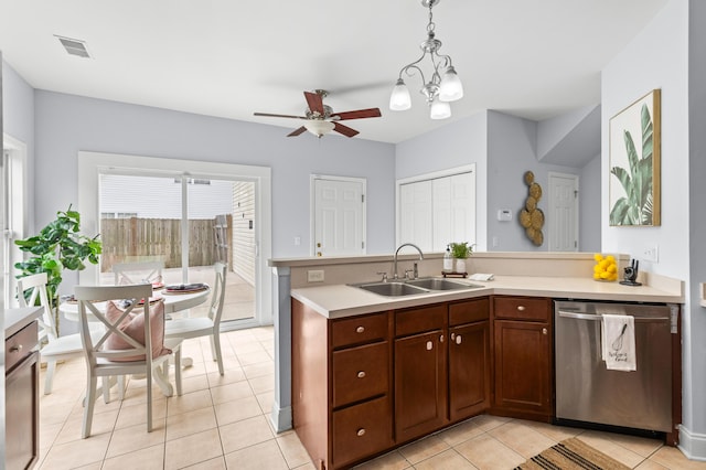 kitchen with light tile patterned flooring, dishwasher, sink, hanging light fixtures, and ceiling fan