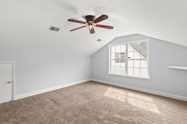 bonus room with ceiling fan, lofted ceiling, and carpet flooring