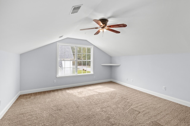 additional living space featuring lofted ceiling, carpet floors, and ceiling fan