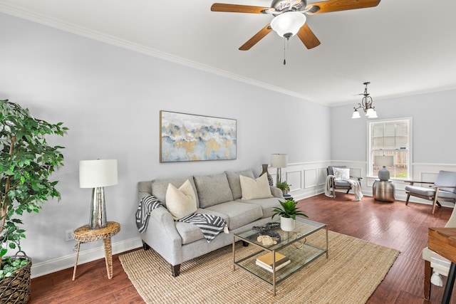 living room featuring crown molding, ceiling fan with notable chandelier, and hardwood / wood-style floors