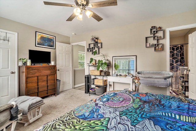 carpeted bedroom featuring ceiling fan