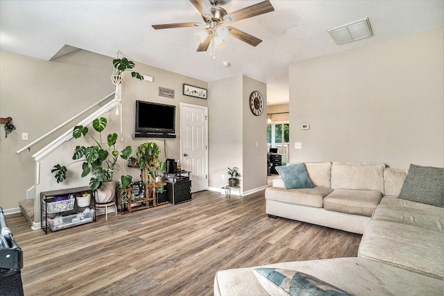 living room with ceiling fan and hardwood / wood-style flooring