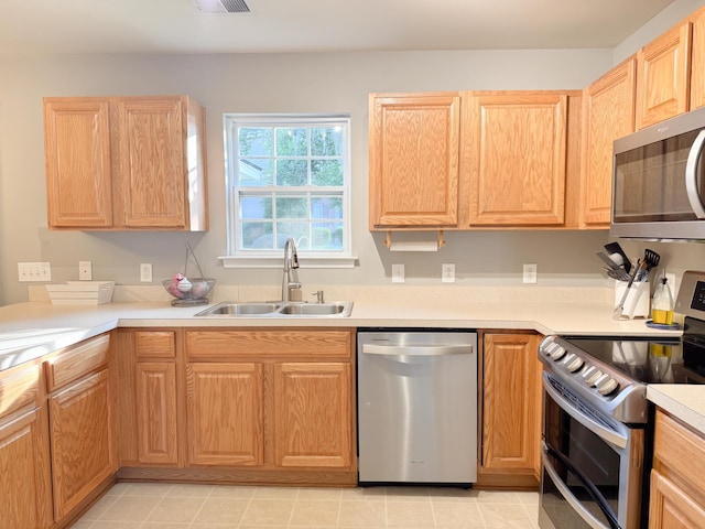 9229 N Moreto Cir, Summerville, SC 29485 - kitchen featuring stainless steel appliances, a sink, light brown cabinets, and light countertops