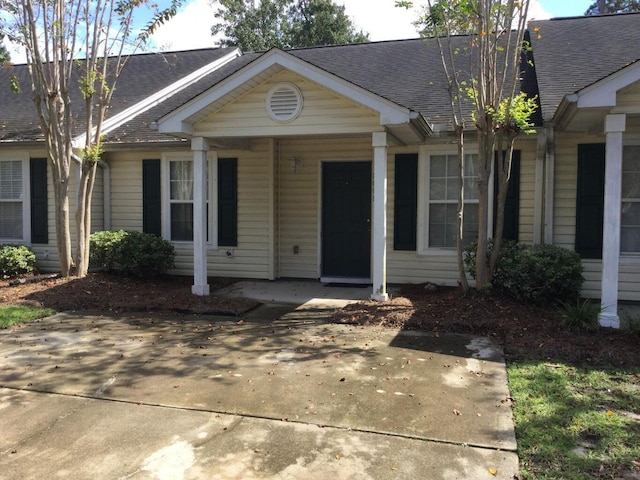 view of front of property with a shingled roof