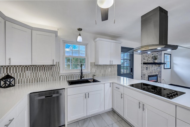 kitchen featuring island exhaust hood, a sink, stainless steel dishwasher, tasteful backsplash, and black electric stovetop