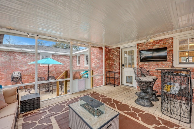 sunroom with wood ceiling