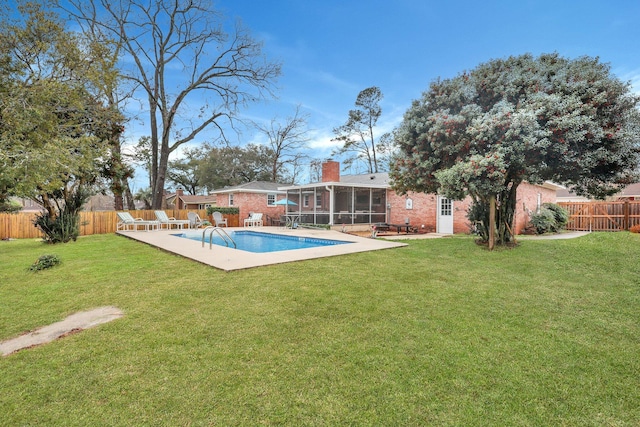 view of pool with a fenced in pool, a fenced backyard, a lawn, and a sunroom