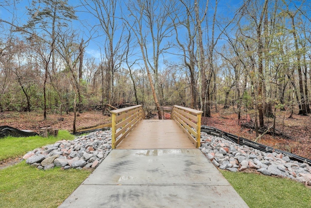 view of property's community featuring a wooded view