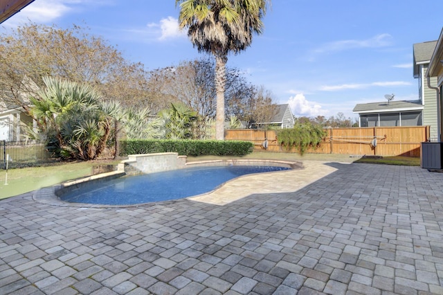 view of swimming pool featuring central AC unit and a patio