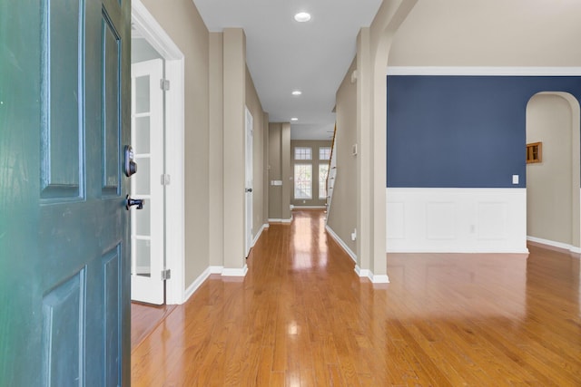 foyer featuring hardwood / wood-style floors and crown molding