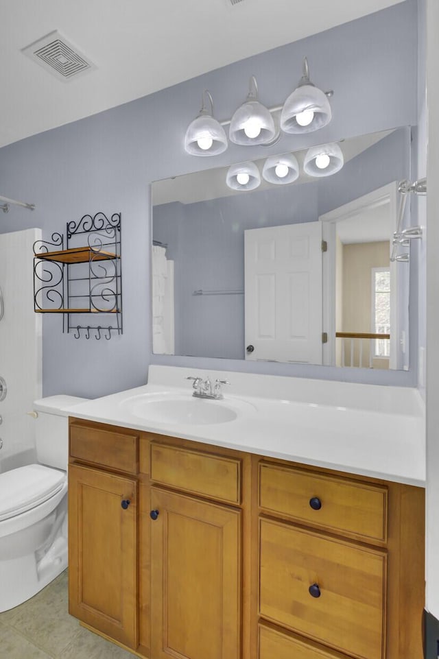 bathroom with curtained shower, tile patterned flooring, vanity, and toilet