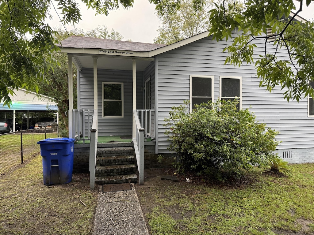 2749 E Surrey Dr, North Charleston, SC 29405 - view of front facade with crawl space and roof with shingles