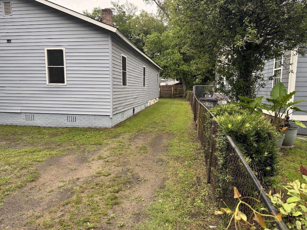 2749 E Surrey Dr, North Charleston, SC 29405 - view of side of home with crawl space and a chimney