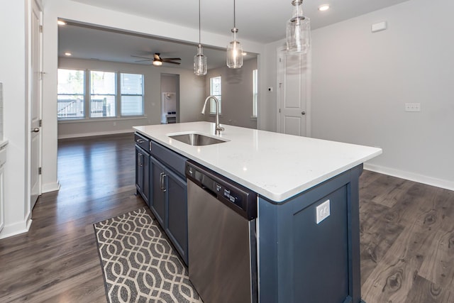 kitchen with dishwasher, dark wood-style flooring, blue cabinets, and a sink