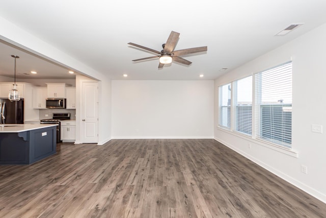 unfurnished living room featuring baseboards, visible vents, recessed lighting, and ceiling fan