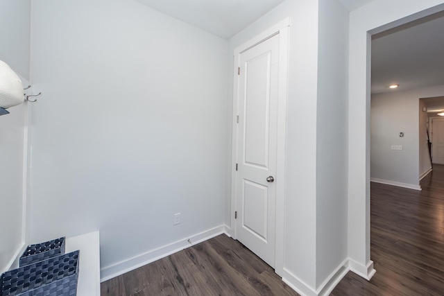hall with baseboards, dark wood-type flooring, and recessed lighting