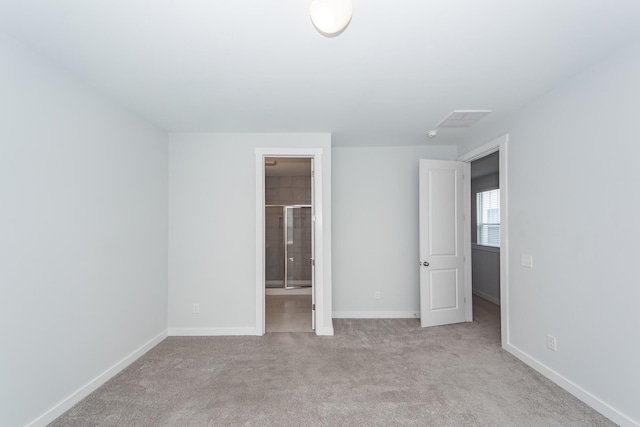 unfurnished bedroom featuring visible vents, baseboards, and carpet floors