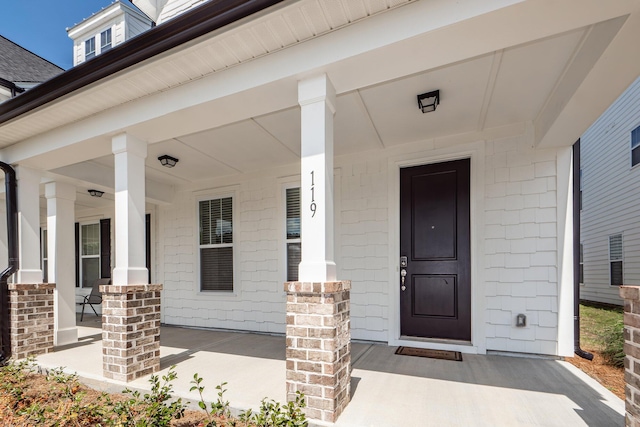 doorway to property with a porch