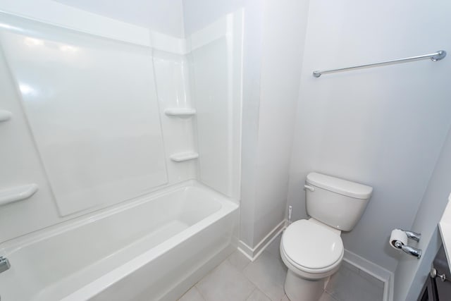 bathroom with  shower combination, tile patterned floors, baseboards, and toilet