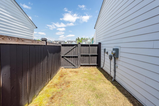 view of yard with a gate and fence