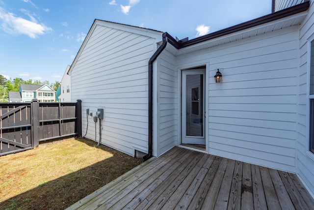 wooden deck featuring fence and a yard