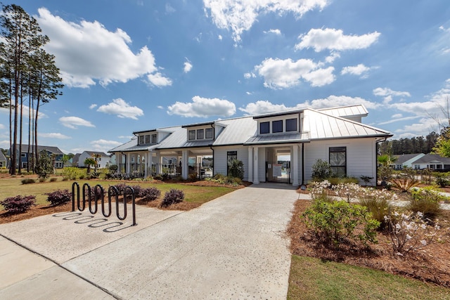 modern inspired farmhouse with a standing seam roof and metal roof