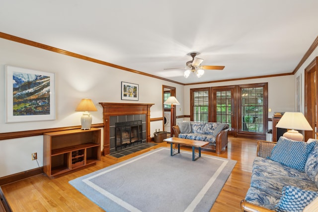 712 Wakendaw Blvd, Mount Pleasant, SC 29464 - living area with wood finished floors, crown molding, a tile fireplace, and ceiling fan