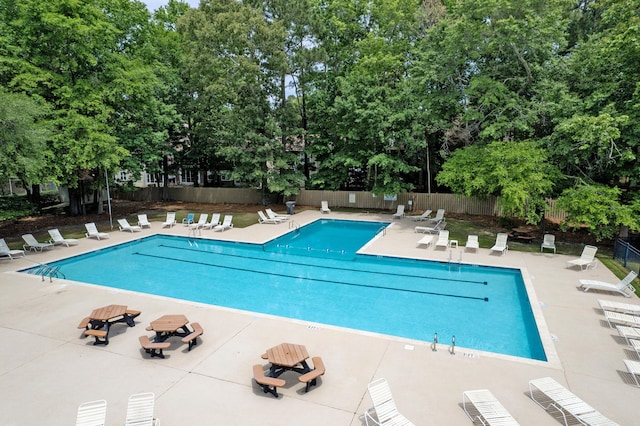 7955 Timbercreek Ln Unit 1807, North Charleston, SC 29418 - community pool featuring fence, a patio, and view of wooded area