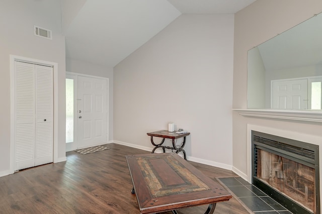 7955 Timbercreek Ln Unit 1807, North Charleston, SC 29418 - entrance foyer featuring vaulted ceiling, wood finished floors, a fireplace with flush hearth, and baseboards