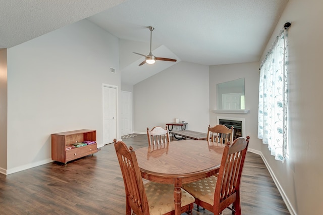 7955 Timbercreek Ln Unit 1807, North Charleston, SC 29418 - dining space with vaulted ceiling, ceiling fan, a fireplace, dark wood-style floors, and baseboards