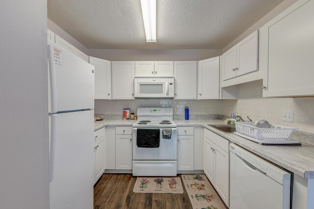 7955 Timbercreek Ln Unit 1807, North Charleston, SC 29418 - kitchen featuring white appliances, wood finished floors, white cabinets, light countertops, and a textured ceiling