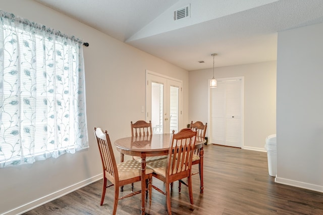 7955 Timbercreek Ln Unit 1807, North Charleston, SC 29418 - dining area with french doors, dark wood finished floors, baseboards, and lofted ceiling