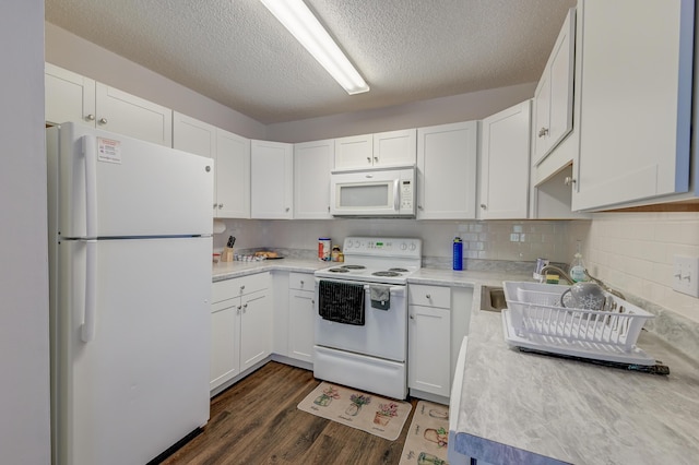 7955 Timbercreek Ln Unit 1807, North Charleston, SC 29418 - kitchen featuring white appliances, light countertops, white cabinetry, dark wood finished floors, and a textured ceiling