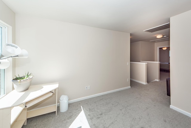 interior space with baseboards and visible vents