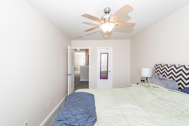 bedroom featuring a ceiling fan, carpet flooring, visible vents, and baseboards