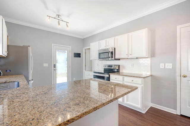 kitchen featuring white cabinets, kitchen peninsula, stainless steel appliances, and light stone counters