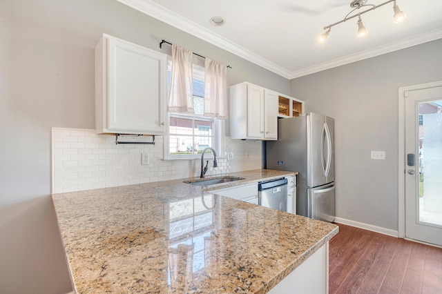 kitchen featuring white cabinetry, light stone counters, sink, and dishwasher