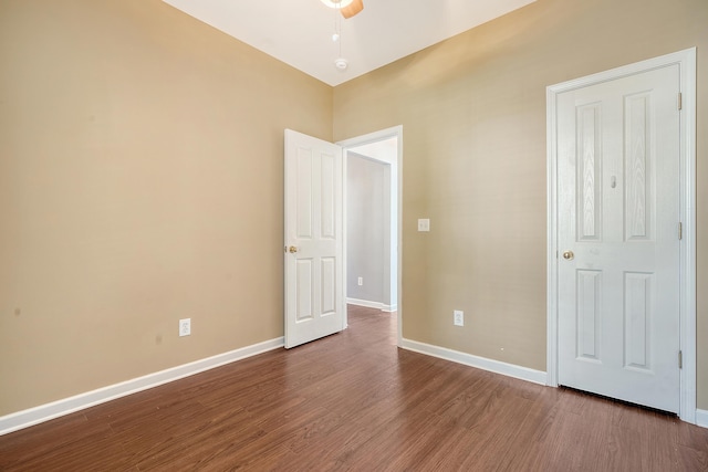 unfurnished bedroom with ceiling fan and wood-type flooring