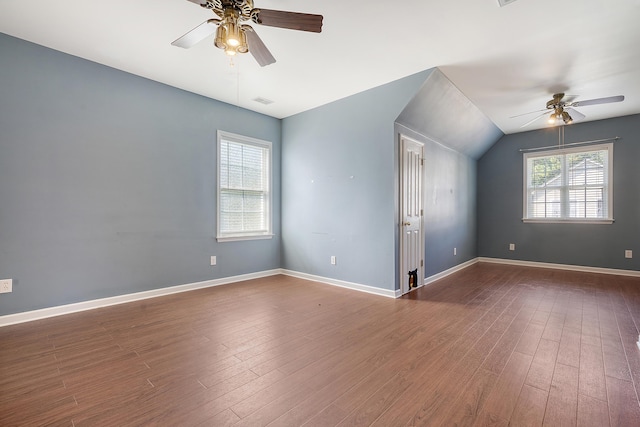 spare room with hardwood / wood-style floors, ceiling fan, and lofted ceiling