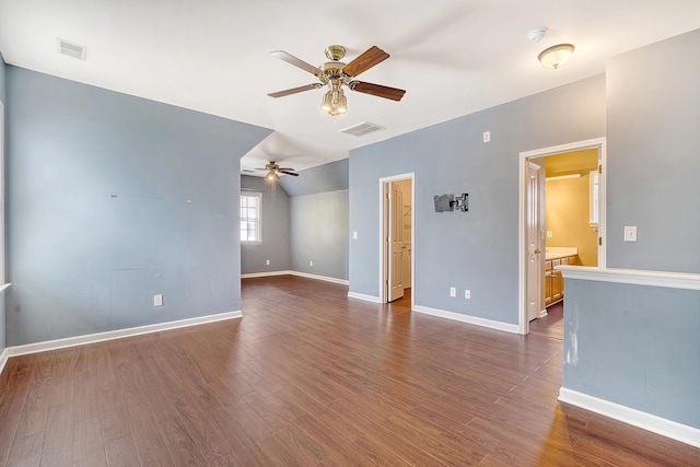 spare room featuring dark hardwood / wood-style flooring and ceiling fan