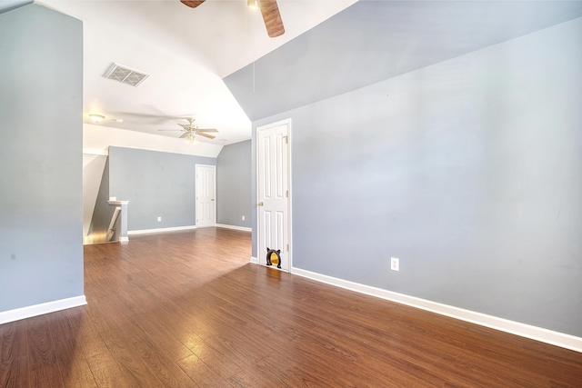 unfurnished room with ceiling fan, wood-type flooring, and vaulted ceiling