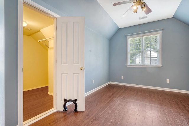 bonus room with dark hardwood / wood-style floors, vaulted ceiling, and ceiling fan