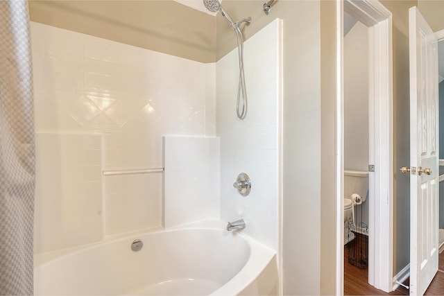 bathroom with shower / bath combo with shower curtain