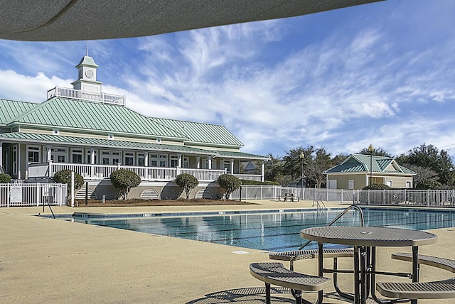 view of swimming pool featuring a patio