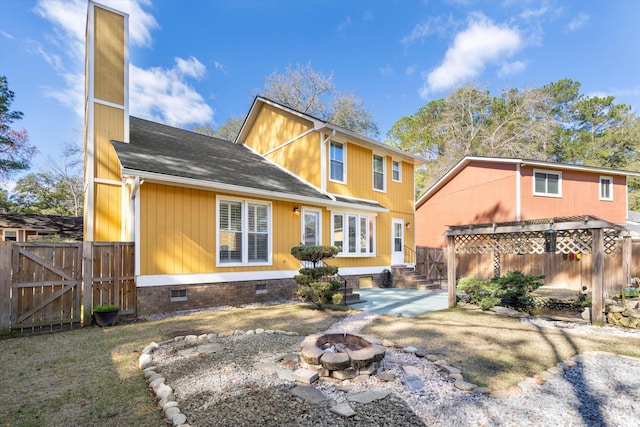 rear view of house with fence, a patio area, roof with shingles, crawl space, and a gate