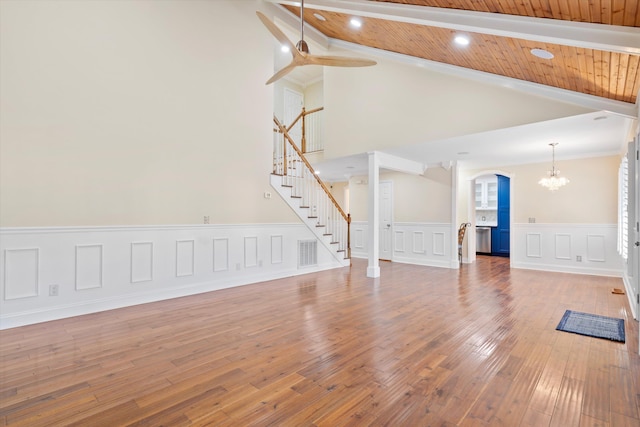 unfurnished living room with hardwood / wood-style floors, visible vents, recessed lighting, stairs, and wooden ceiling